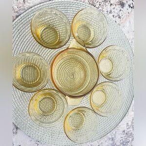 Set of seven yellow glass bowls for desserts or sauces and an extra bowl